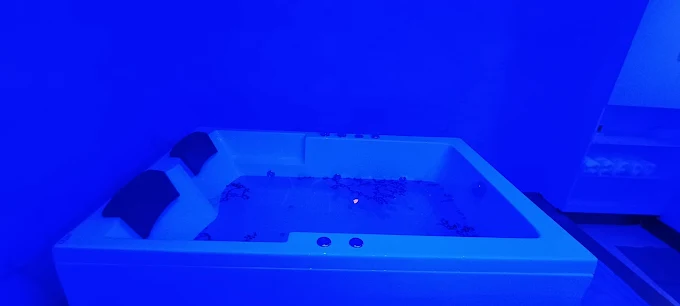 Bath area with blue lighting at Sky Days Spa