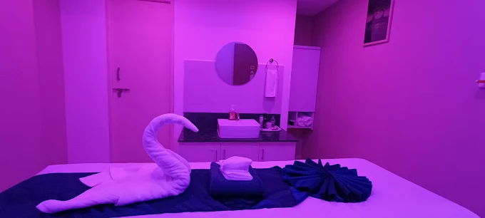 Folded towel arrangement on a massage bed at Sky Days Spa